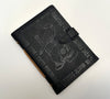 Black Leather Grimoire with Skull and Candle