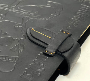 Black Leather Grimoire with Skull and Candle