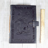 Black Leather Grimoire with Skull and Candle