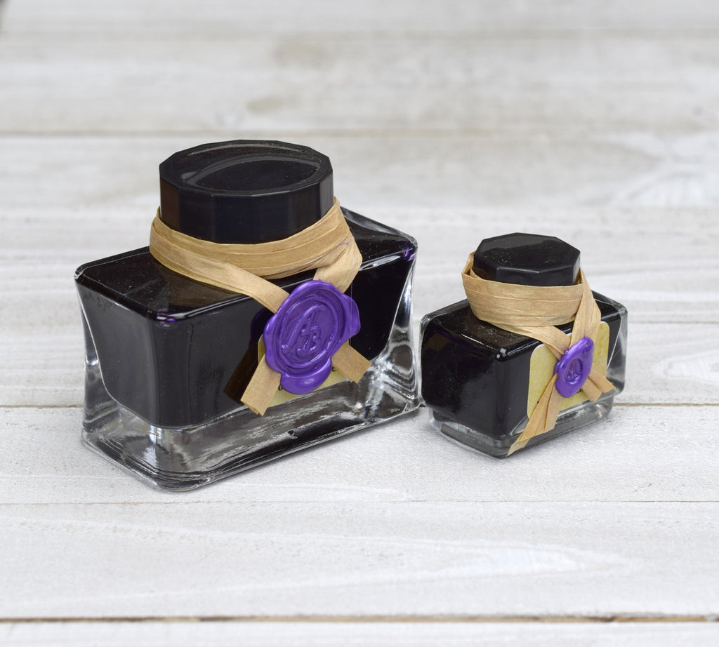 two sizes of purple writing ink