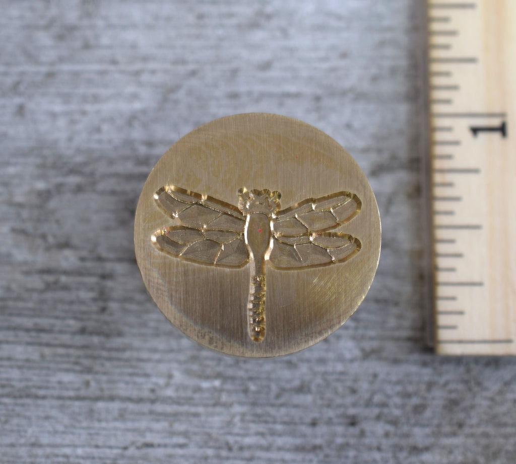 closeup of dragonfly stamp head