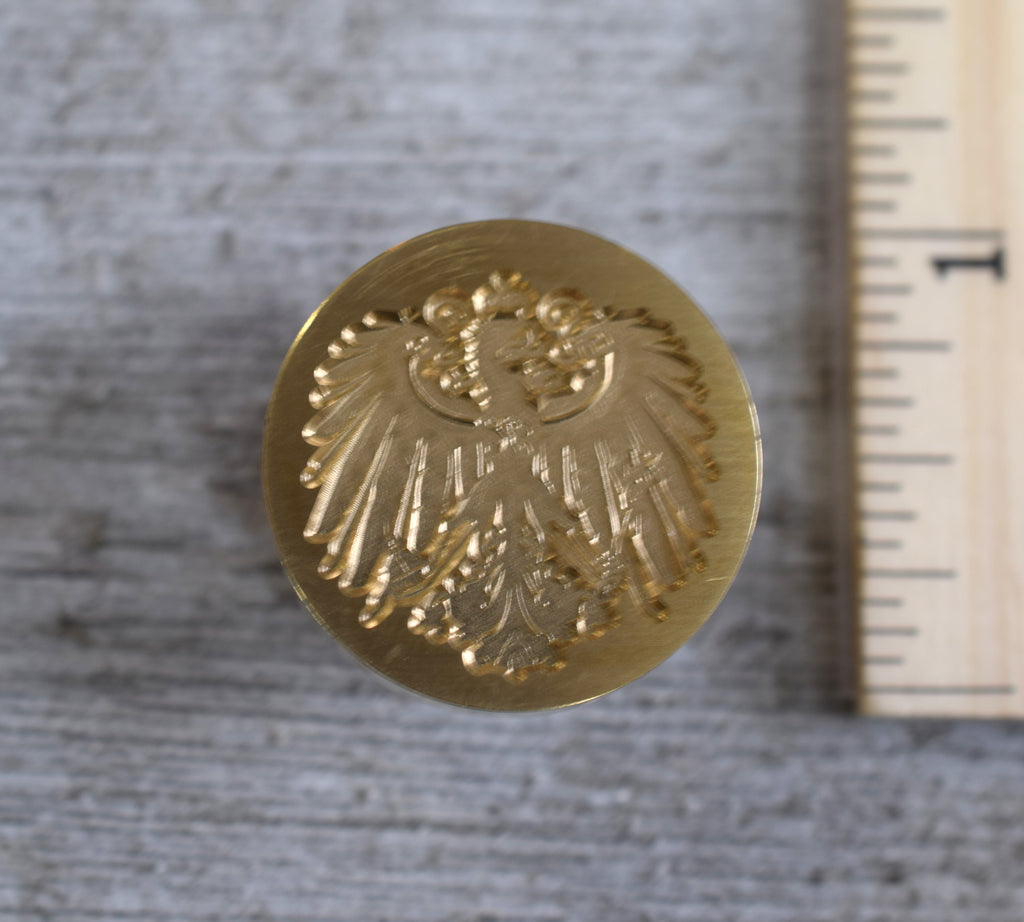 closeup of heraldic eagle brass stamp head